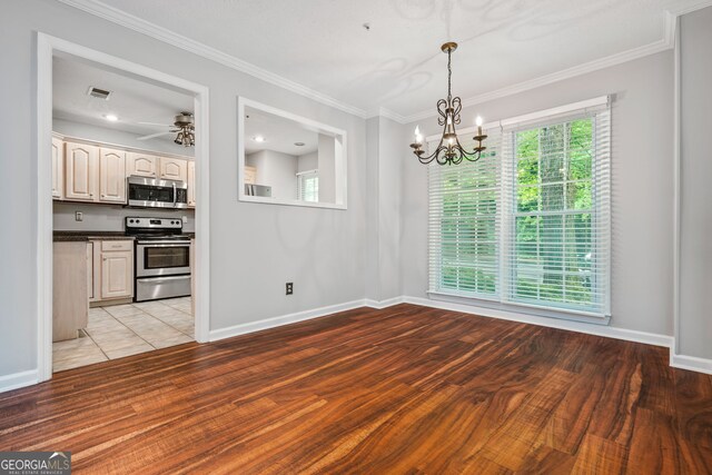 unfurnished bedroom with baseboards, a ceiling fan, a textured ceiling, and wood finished floors