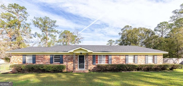 ranch-style home with a front lawn