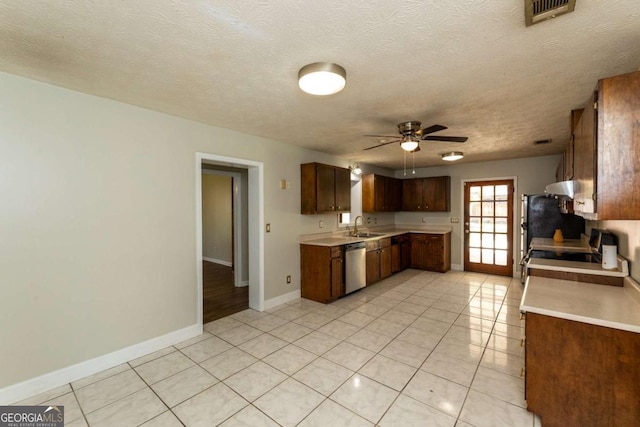 kitchen with ceiling fan, dishwasher, sink, and light tile patterned floors