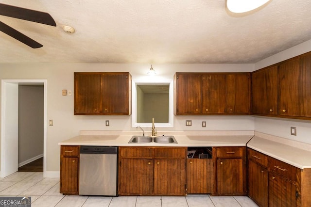 kitchen featuring sink, stainless steel dishwasher, ceiling fan, and light tile patterned floors