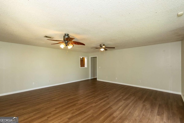 unfurnished room with dark hardwood / wood-style flooring, ceiling fan, and a textured ceiling