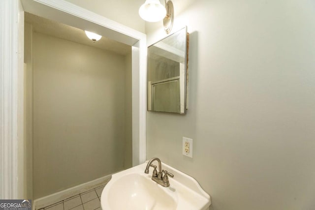 bathroom featuring tile patterned floors and sink