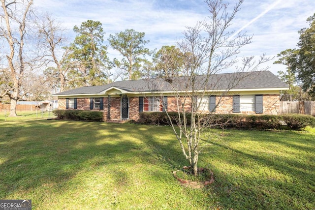 ranch-style home with a front lawn