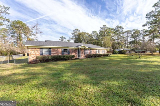 ranch-style home featuring a front yard