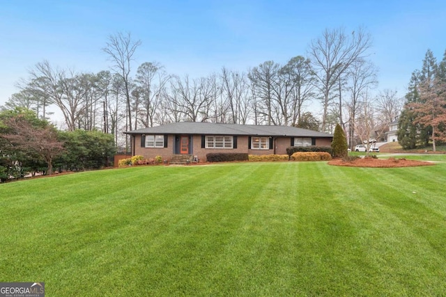 single story home with a front yard