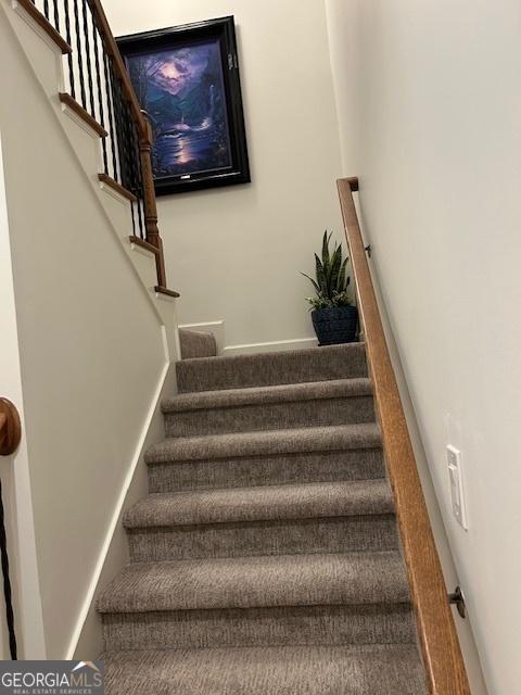 staircase with baseboards