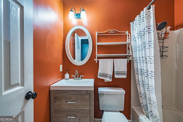 full bathroom with vanity, shower / bath combination with curtain, and toilet