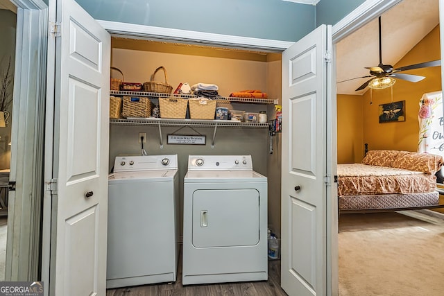 laundry room with washer and dryer, ceiling fan, and light hardwood / wood-style flooring