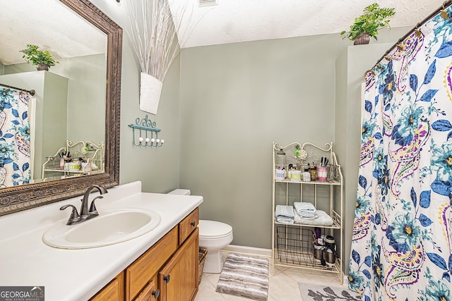 bathroom with tile patterned flooring, vanity, curtained shower, and toilet