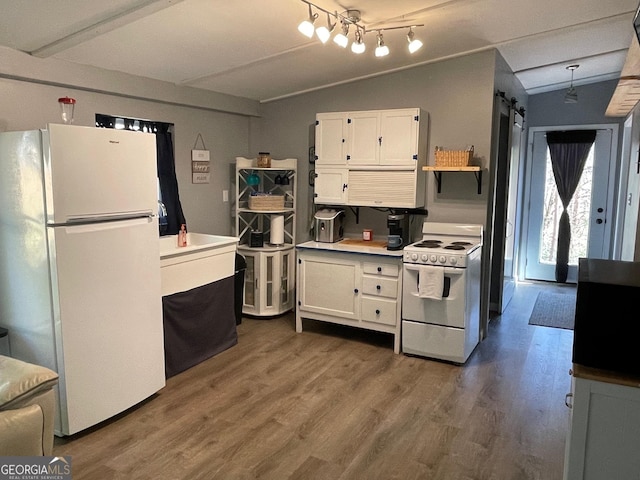 kitchen with vaulted ceiling, dark wood-type flooring, white cabinets, and white appliances