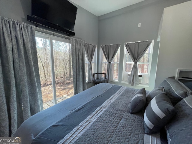 bedroom featuring multiple windows