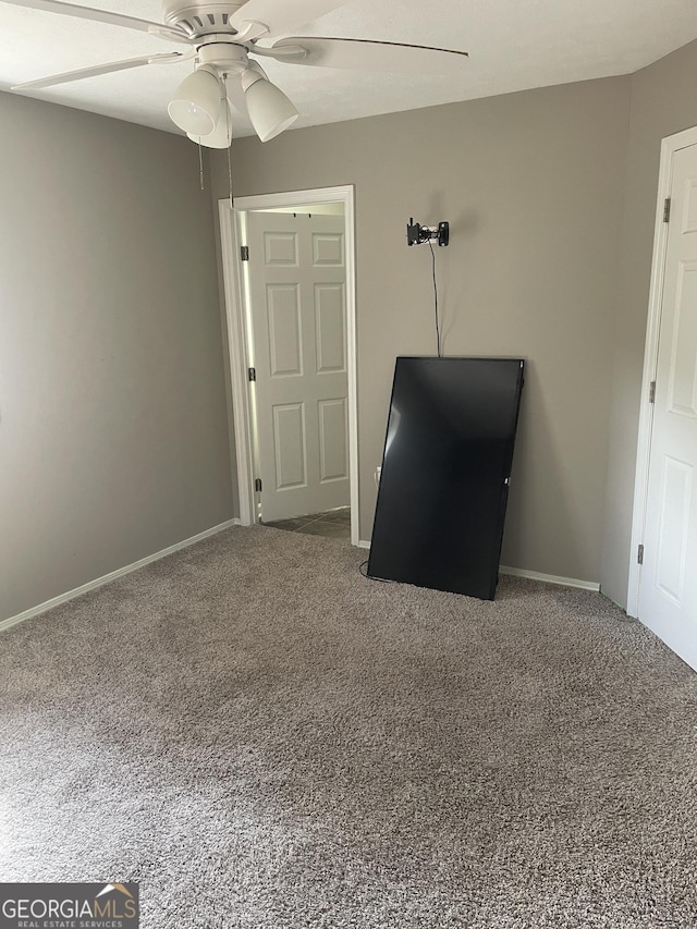 unfurnished bedroom with carpet and ceiling fan