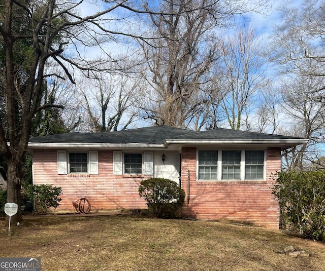 ranch-style house with a front lawn