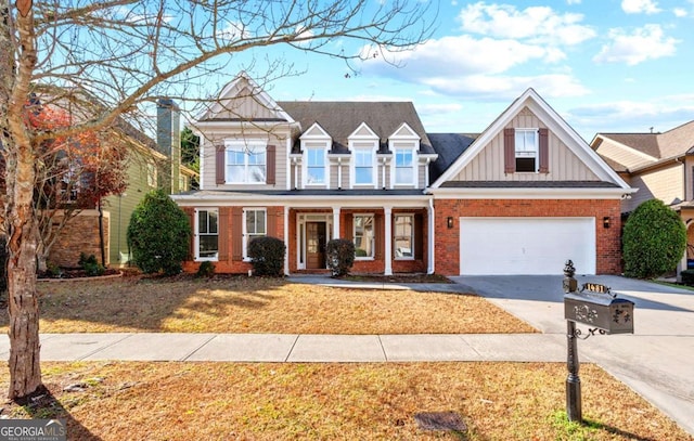 view of front of home featuring a porch and a garage