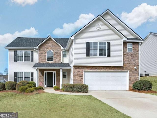 view of front of property featuring a garage and a front yard