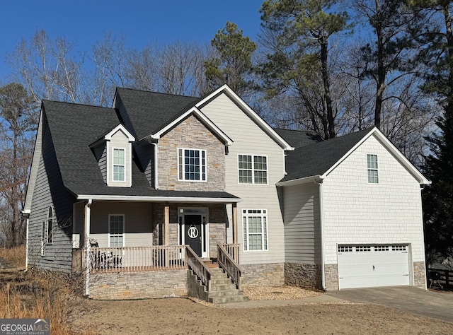 view of front of property with a porch and a garage