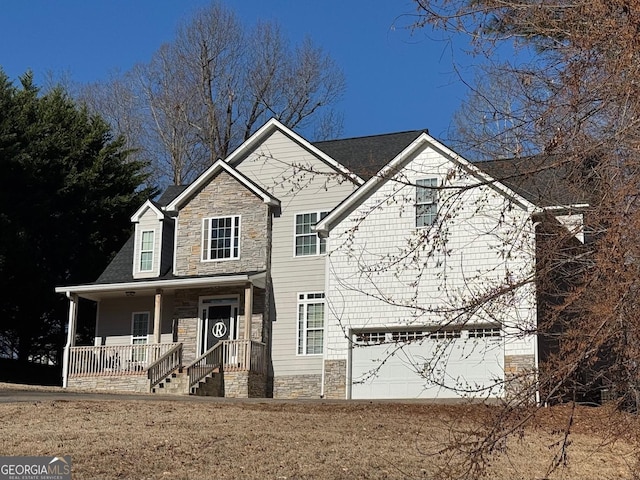 view of front facade with a garage and covered porch