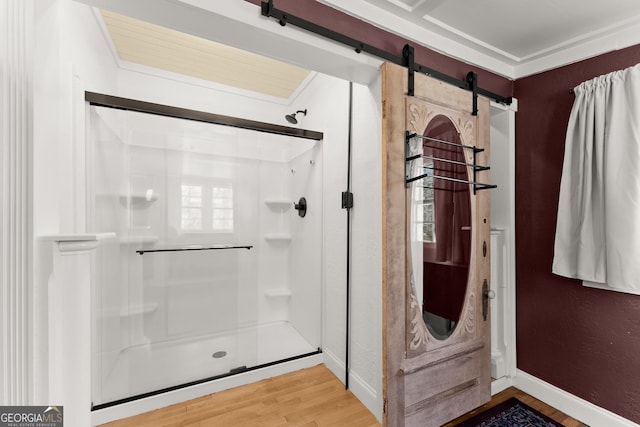 bathroom with wood-type flooring and walk in shower