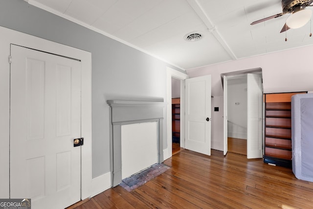 interior space featuring ceiling fan and dark hardwood / wood-style floors