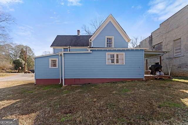 rear view of house with a carport