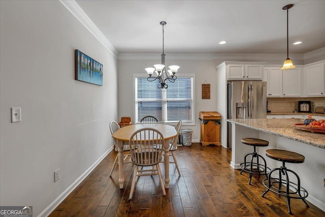 3890 Pleasant Woods Dr, Cumming, GA 30028 - dining area with recessed lighting, crown molding, dark wood-style flooring, baseboards, and an inviting chandelier