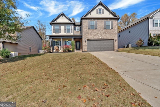 view of front of property with a porch, a garage, brick siding, concrete driveway, and a front yard