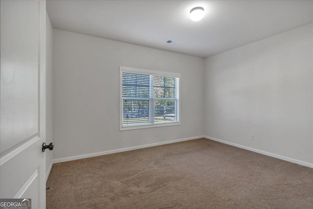 3890 Pleasant Woods Dr, Cumming, GA 30028 - spare room featuring carpet flooring, visible vents, and baseboards