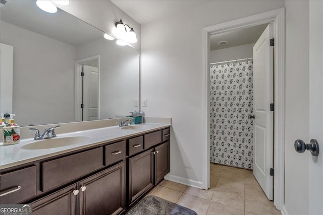 3890 Pleasant Woods Dr, Cumming, GA 30028 - full bathroom featuring double vanity, baseboards, a shower with curtain, tile patterned flooring, and a sink
