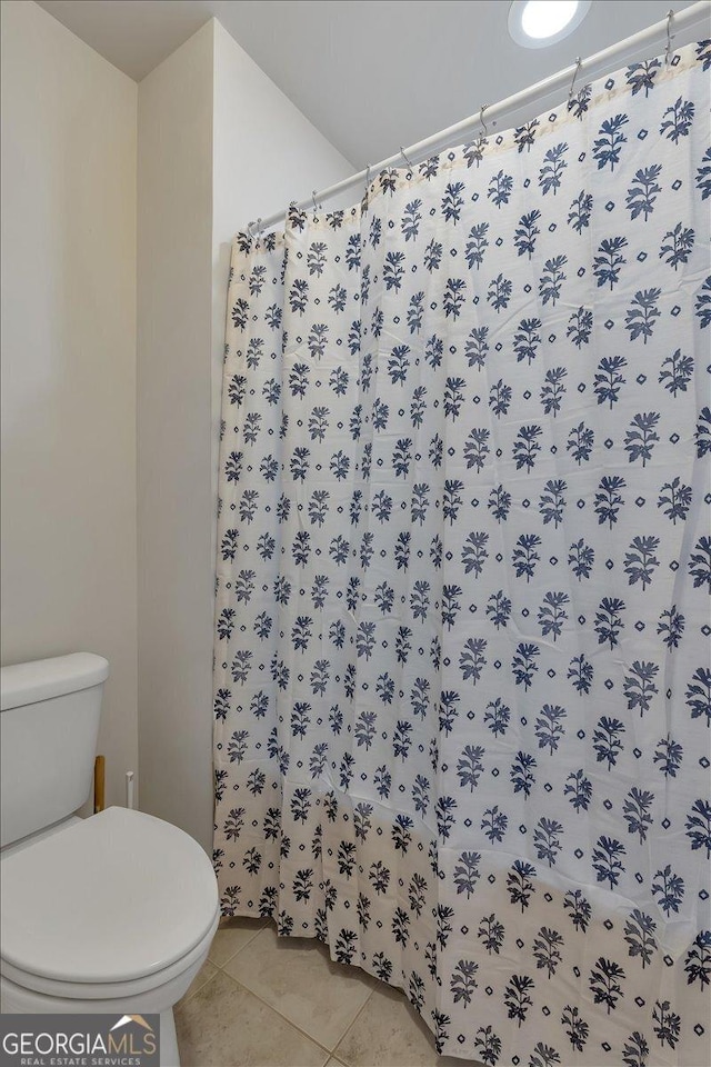 3890 Pleasant Woods Dr, Cumming, GA 30028 - bathroom featuring curtained shower, tile patterned flooring, and toilet