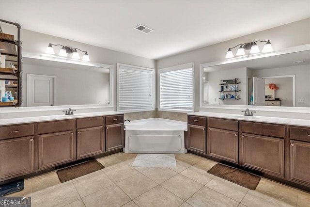 3890 Pleasant Woods Dr, Cumming, GA 30028 - full bathroom featuring visible vents, two vanities, and a sink