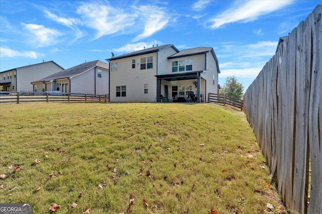 3890 Pleasant Woods Dr, Cumming, GA 30028 - rear view of house with a fenced backyard and a yard