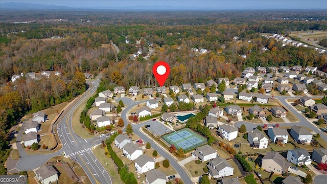 3890 Pleasant Woods Dr, Cumming, GA 30028 - bird's eye view with a residential view and a wooded view