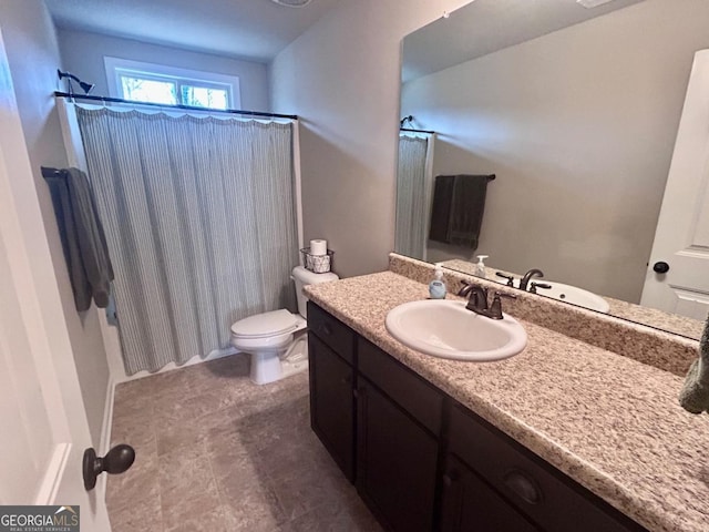 full bath with toilet and vanity