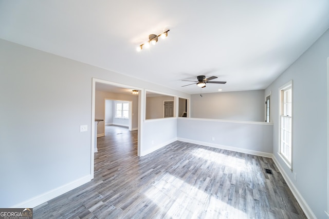 empty room with wood-type flooring and ceiling fan