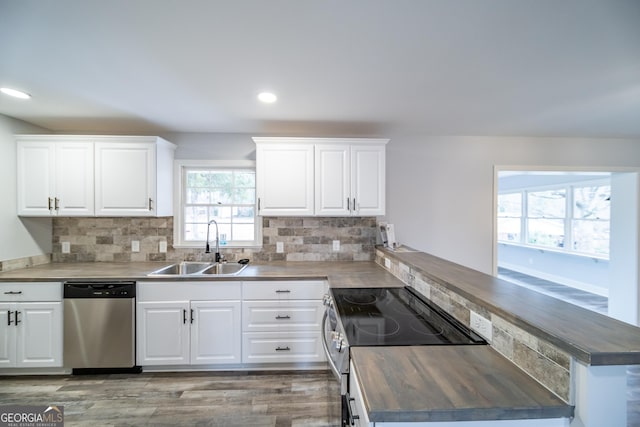 kitchen with white cabinetry, sink, wooden counters, and appliances with stainless steel finishes