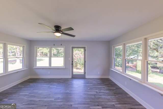 unfurnished sunroom with a wealth of natural light and ceiling fan