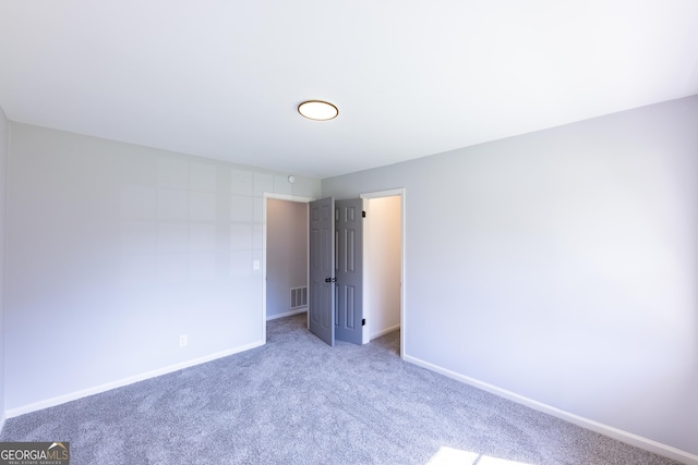 unfurnished bedroom with carpet floors