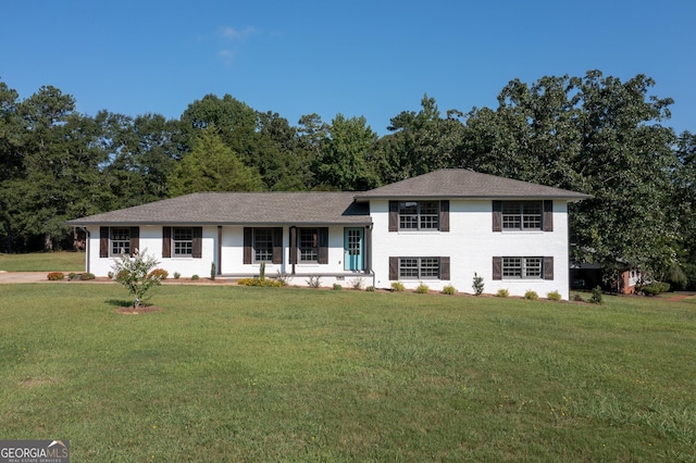 view of front of house with a porch and a front yard