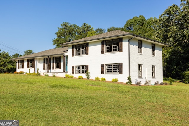 tri-level home with a front yard