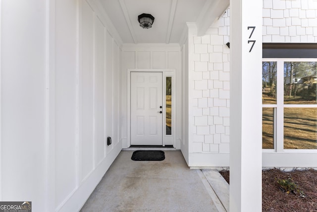 doorway to property featuring board and batten siding