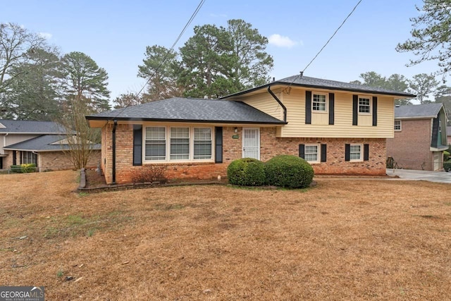 split level home with a front yard