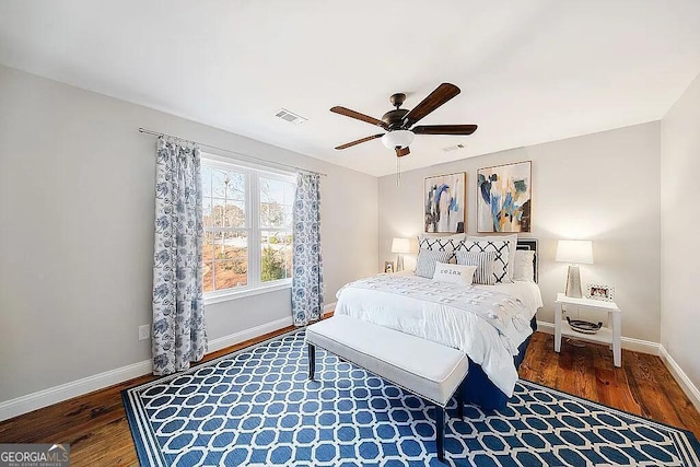 bedroom with dark wood-type flooring and ceiling fan