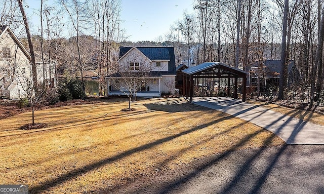 view of front of home with a gazebo and a front lawn