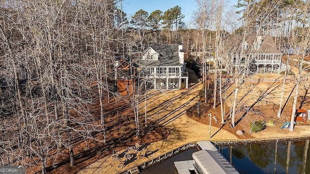 birds eye view of property featuring a water view