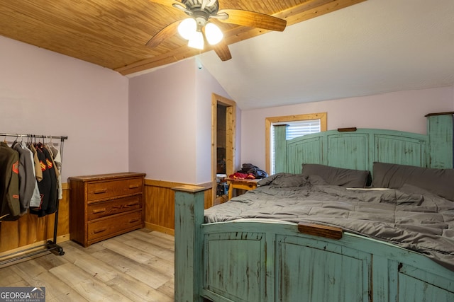 bedroom featuring ceiling fan, lofted ceiling, and light hardwood / wood-style flooring