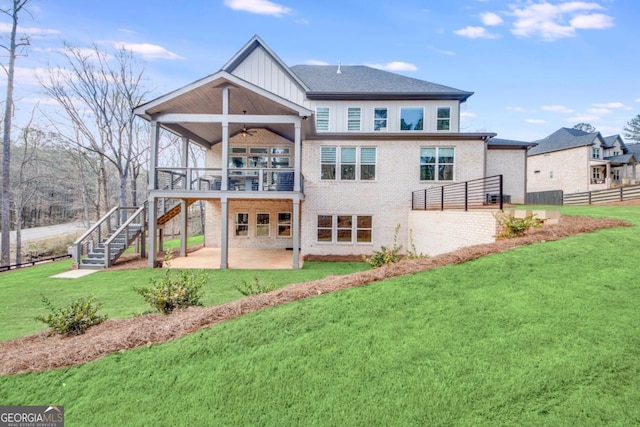 back of property featuring a lawn, a patio, and ceiling fan