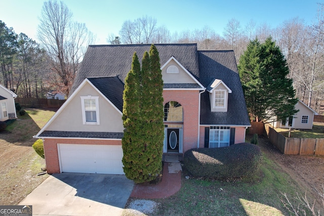 view of property with a garage and a front yard