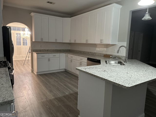 kitchen with hardwood / wood-style floors, white cabinetry, sink, light stone counters, and crown molding