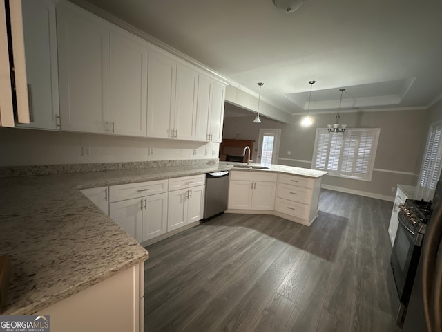 kitchen with decorative light fixtures, white cabinetry, stainless steel dishwasher, kitchen peninsula, and a raised ceiling