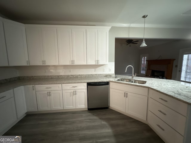 kitchen with decorative light fixtures, dishwasher, sink, white cabinets, and dark wood-type flooring